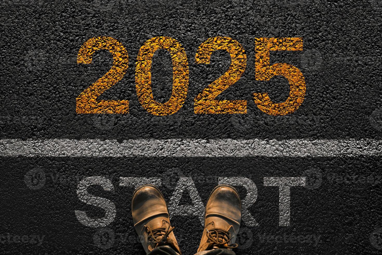 Man walks on asphalt and crosses the line by 2025. New year 2025, creative. Men's legs with leather shoes go to 2025. Start and beginning of 2025, concept photo