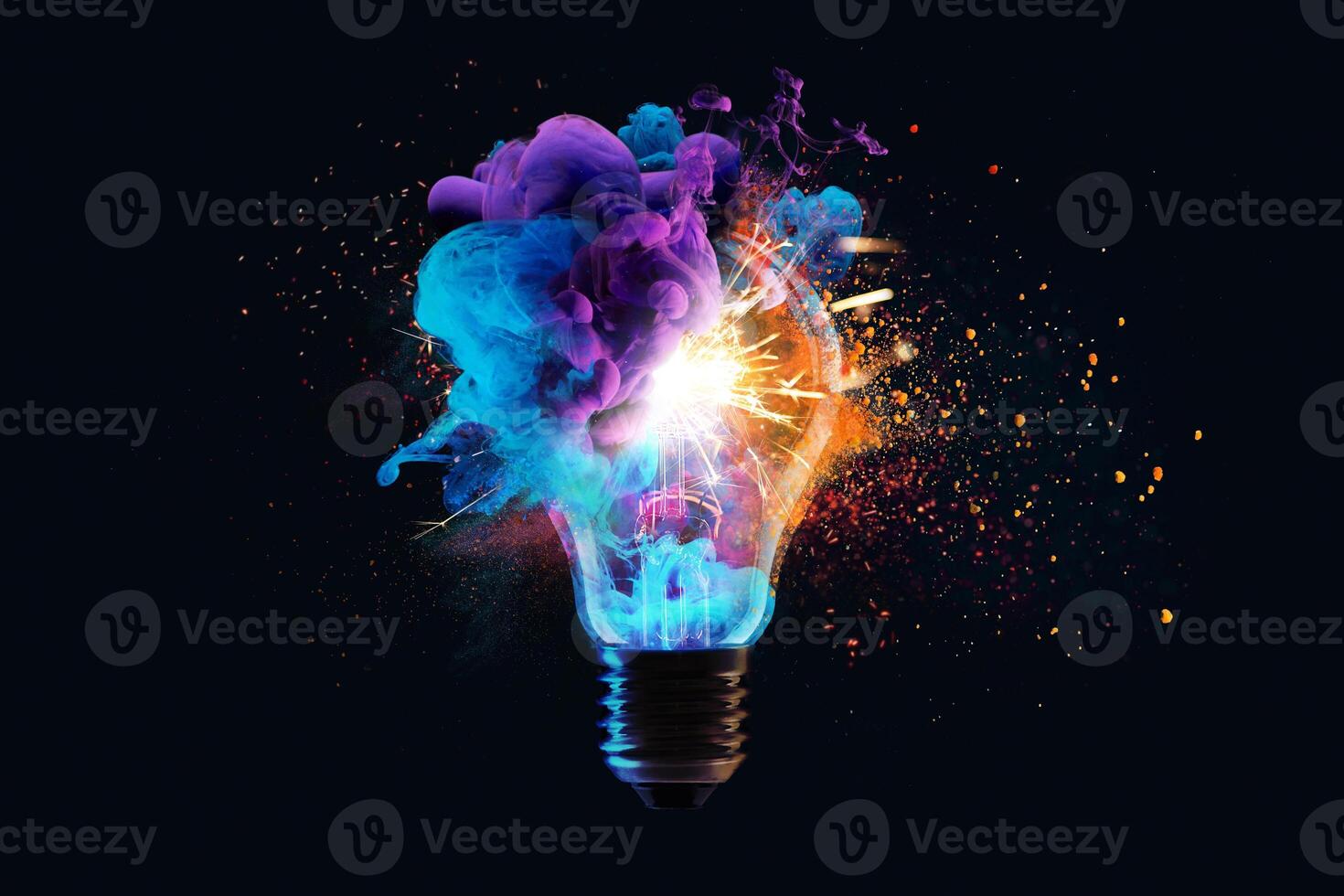Creative light bulb explodes with colorful dry paint, sparks and splashes on a black background, concept. Think differently creative idea concept. Motion Color drop in water, Ink swirling photo