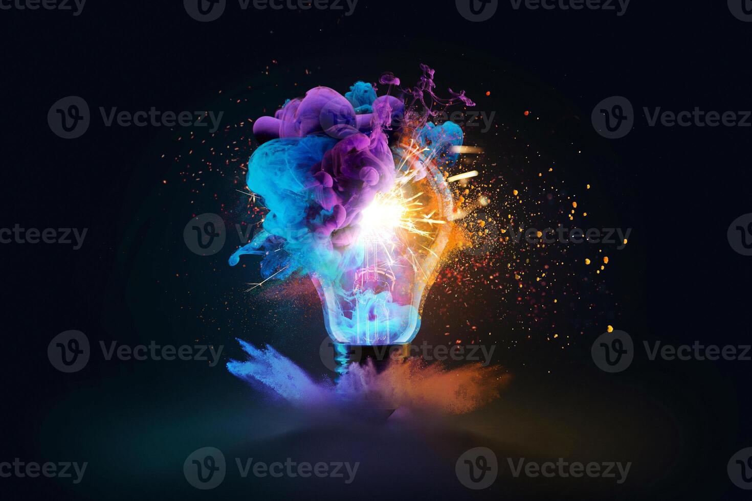 Creative light bulb explodes with colorful dry paint, sparks and splashes on a black background, concept. Think differently creative idea concept. Motion Color drop in water, Ink swirling photo