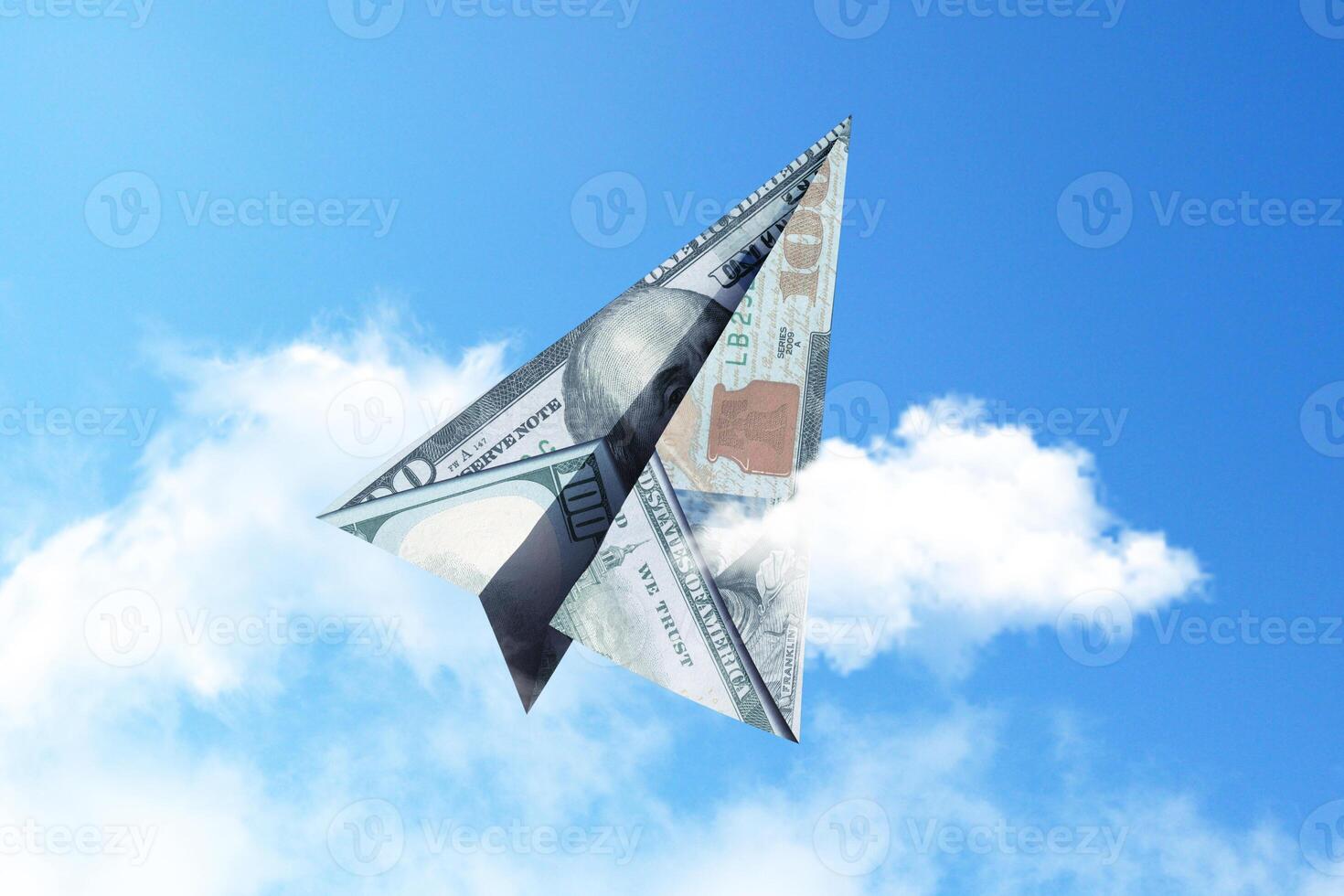 Paper airplane 100 dollars flies into the sky with clouds, creative idea. Startup and investment finance, concept. Insurance and deposits photo