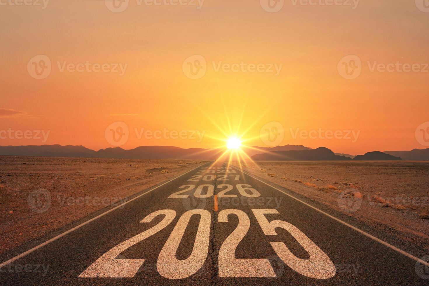 New year 2025 or straight forward concept. Text 2025 written on the road in the middle of asphalt road at sunset. Concept of planning, goal, challenge, new year resolution. photo