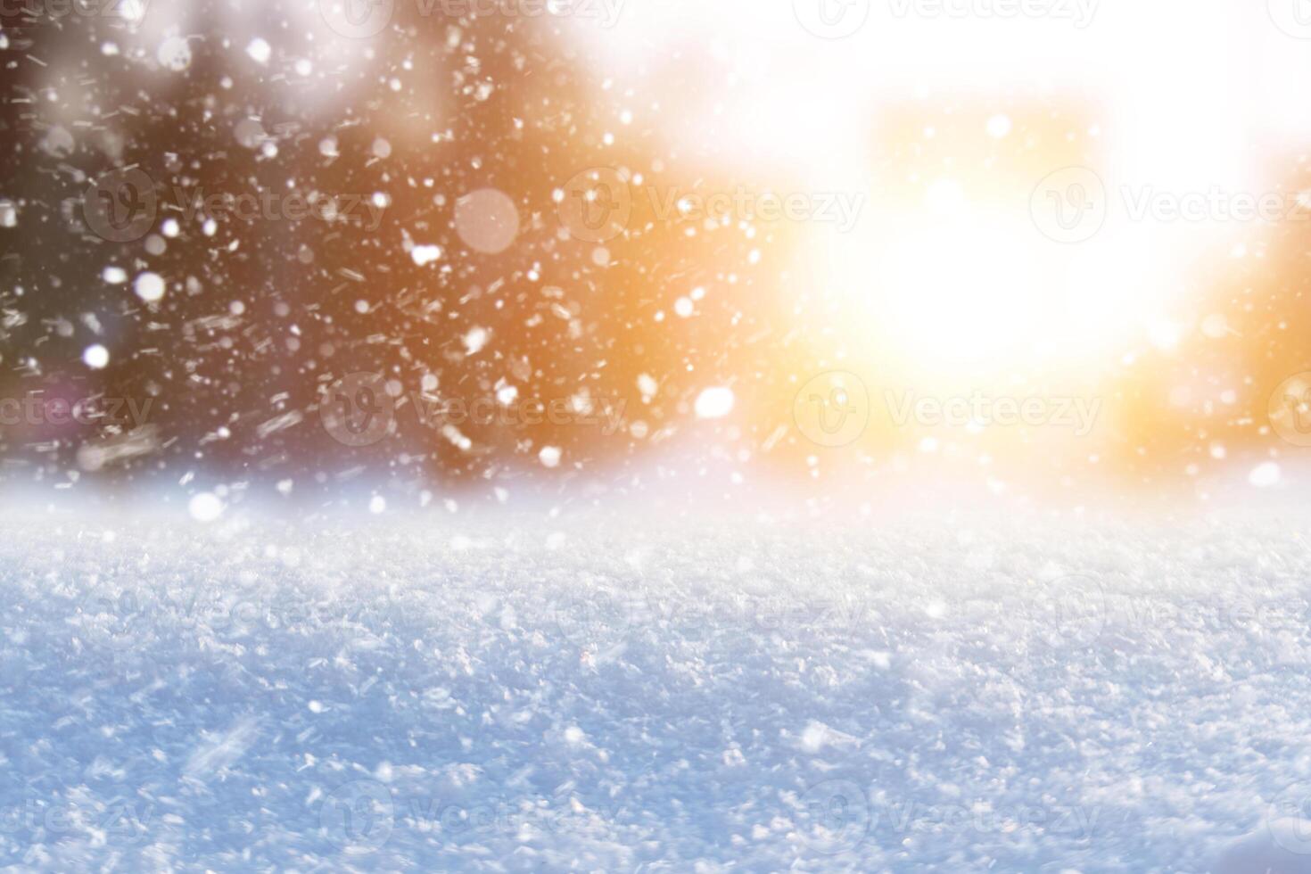 Amazing winter blurred background with snow and sunset. White snow with orange sunlight, card. Winter background. Free copy space for design and text. Freezing photo