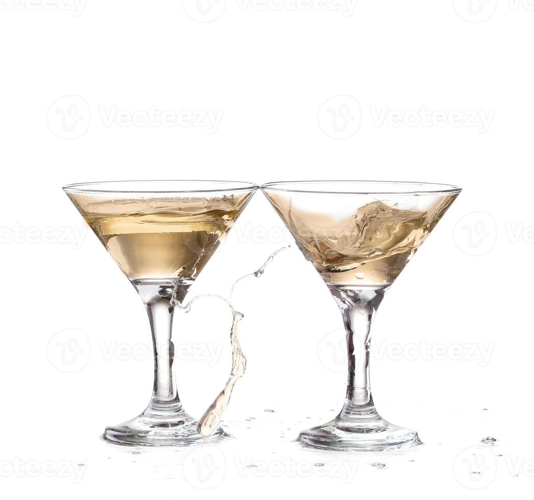 two wine swirling in a goblet martini glass, isolated on white background photo