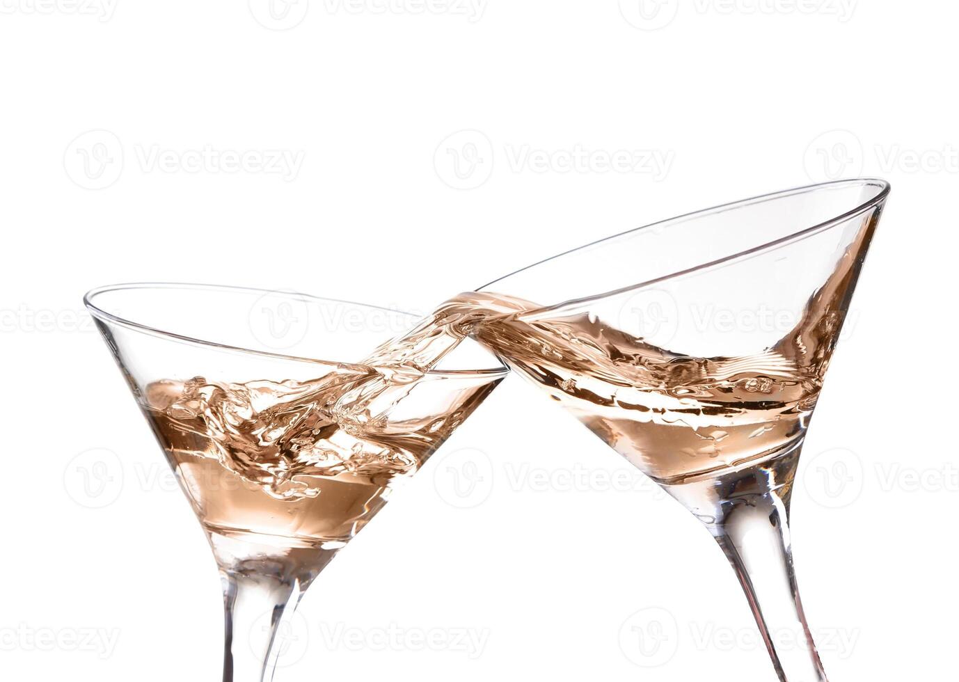 two wine swirling in a goblet martini glass, isolated on white background photo