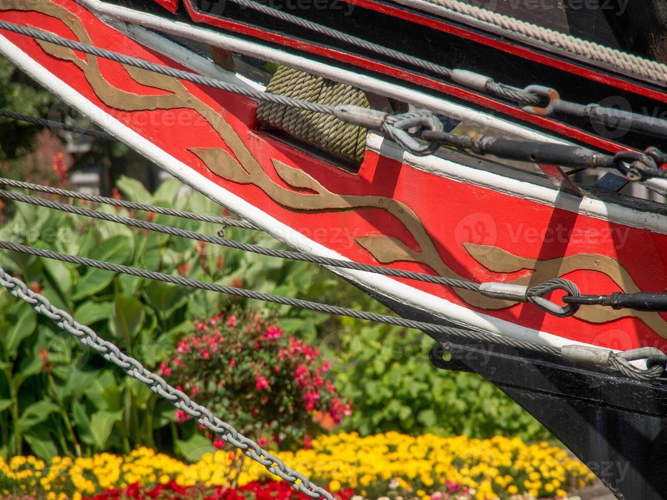 A close up of a ship with flowers in the background photo