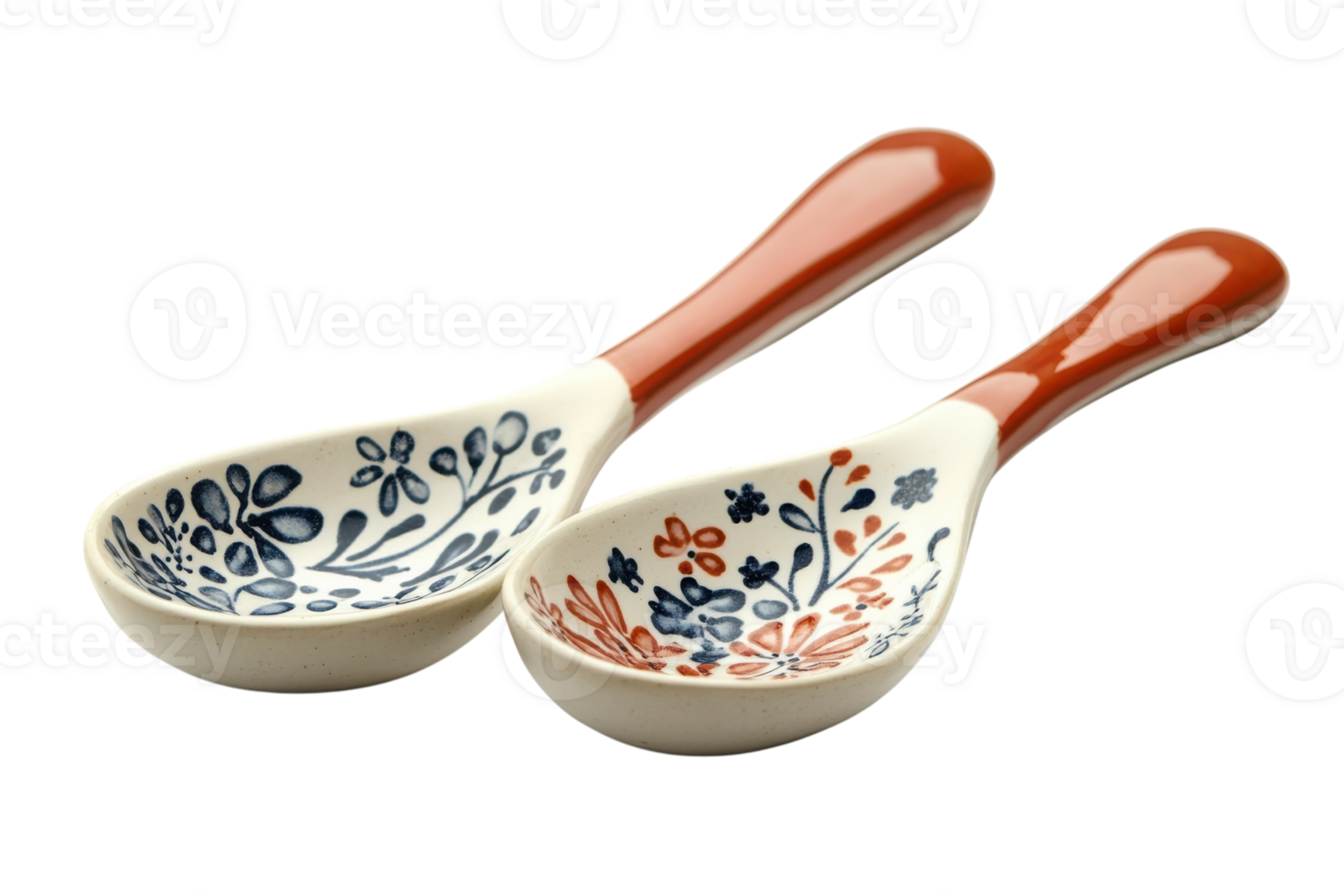 Decorative ceramic spoons with floral designs in contrasting colors displayed on a white background png