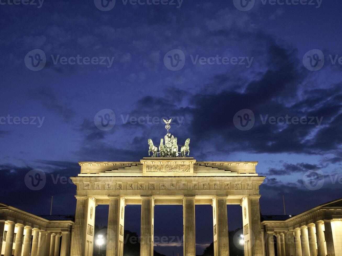 A building with a clock tower in berlin photo