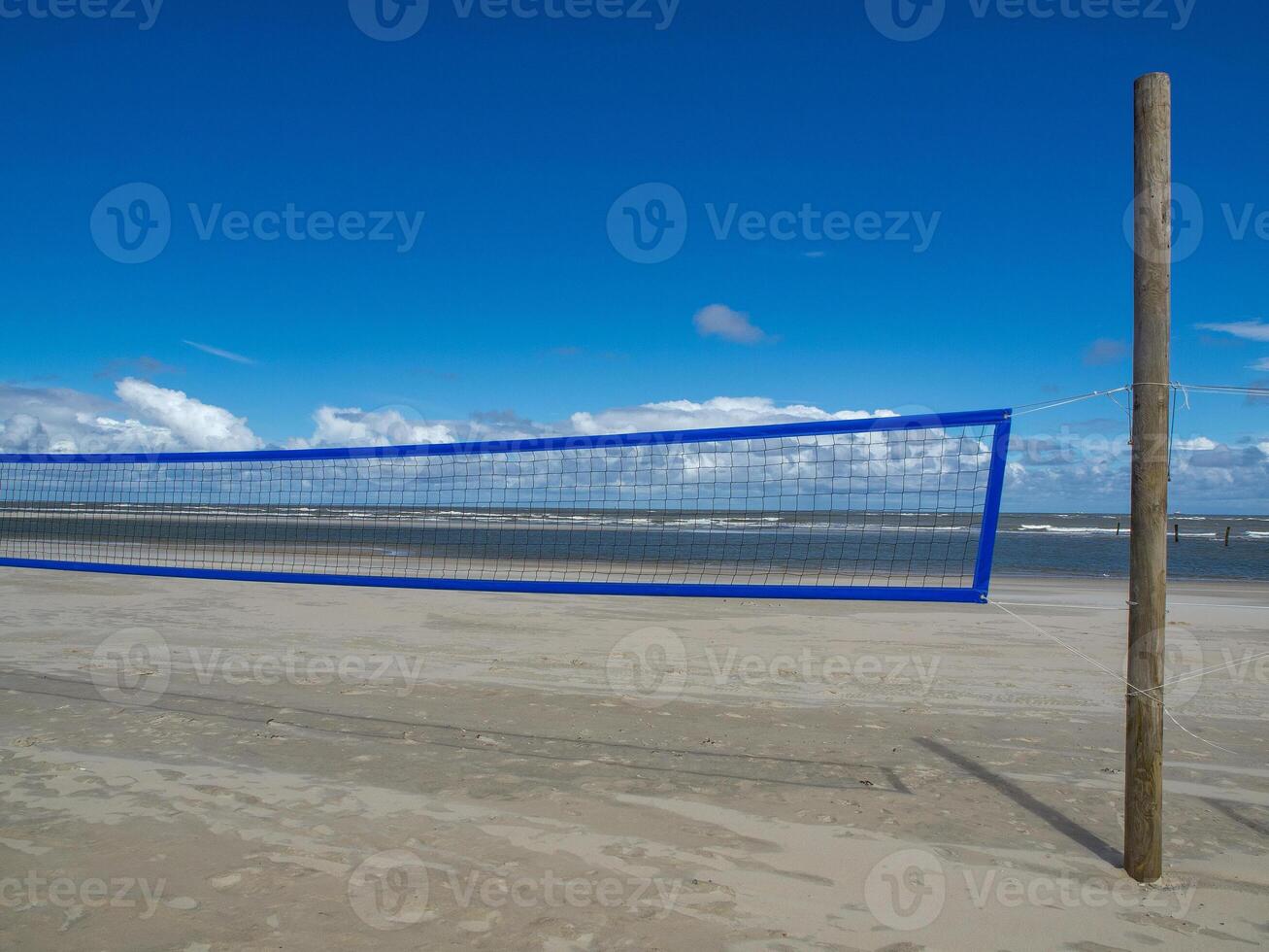 A volleyball net on the beach of norderney photo