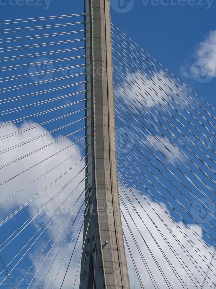 A bridge with a clock tower photo
