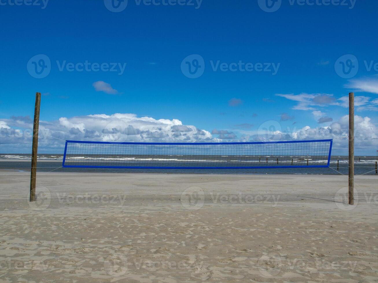 A volleyball net on a beach photo
