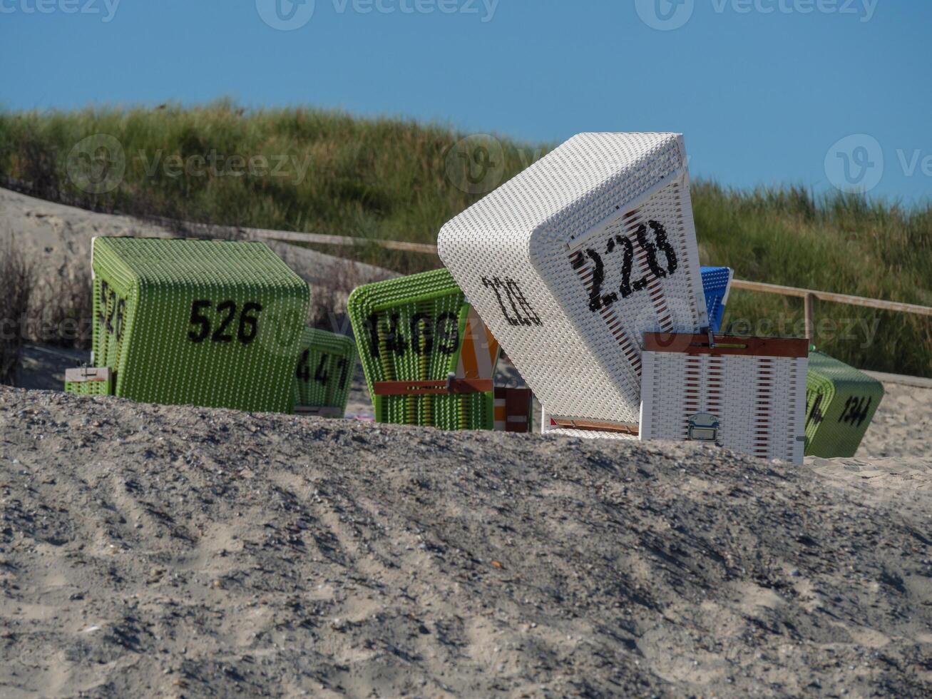 A group of chairs on the beach of langeoog photo