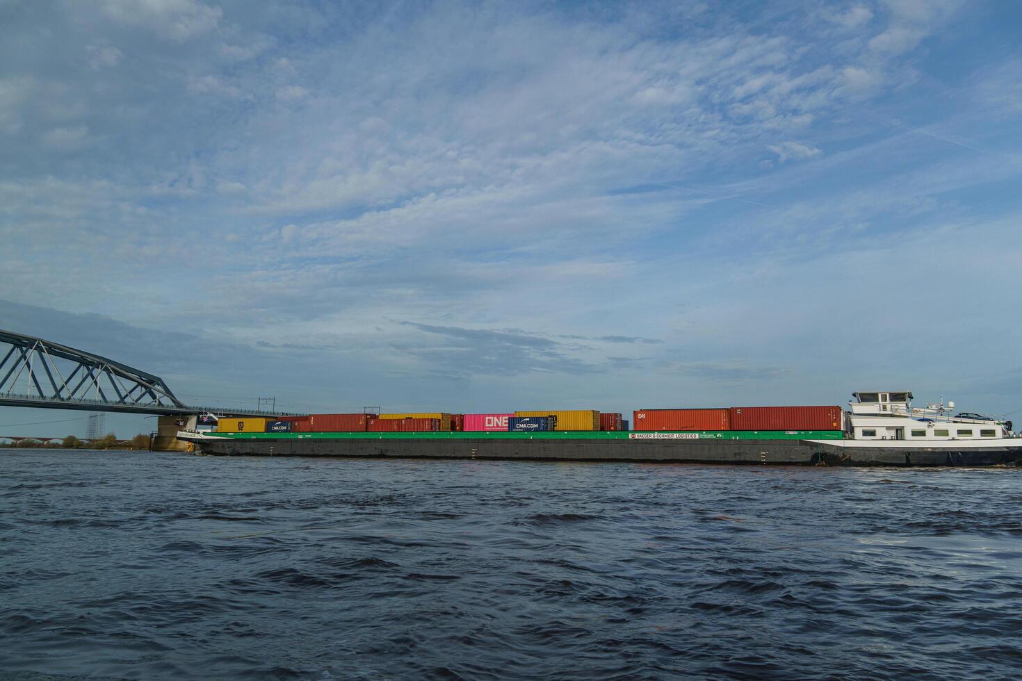A large cargo ship traveling through the water photo