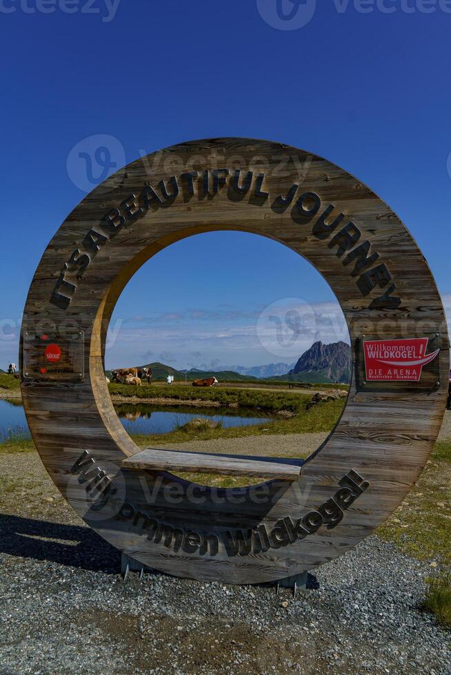 A large wooden sign with a circular design photo