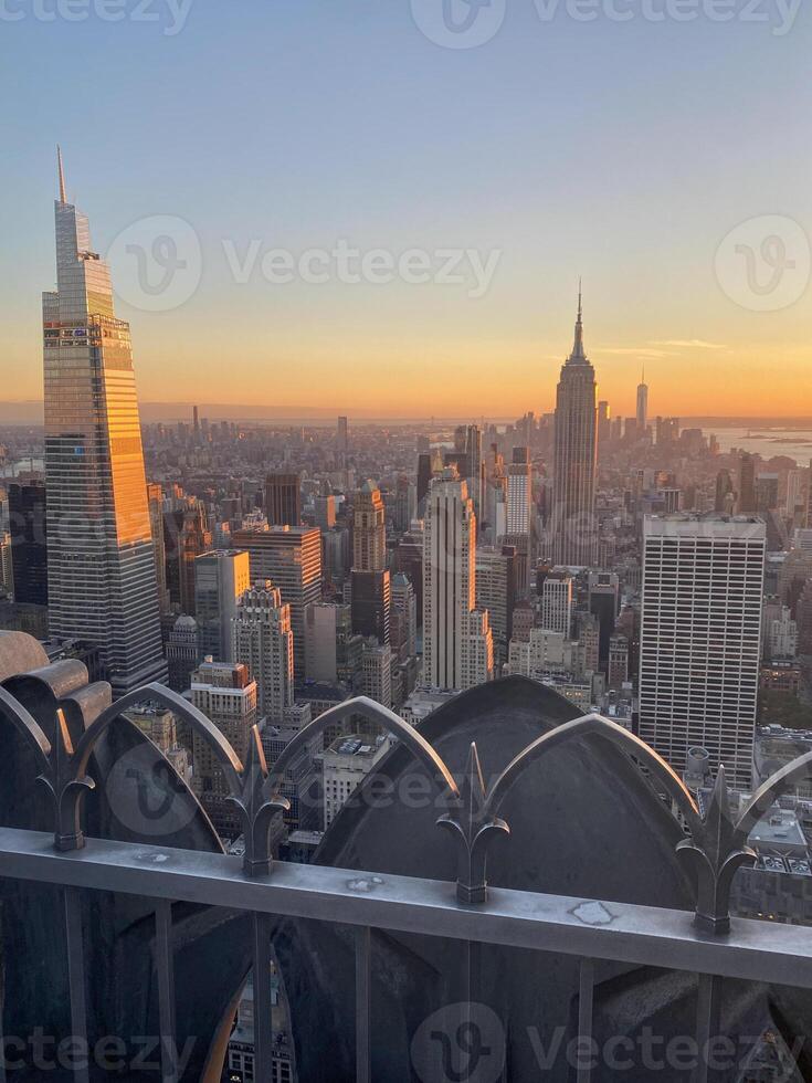 The empire state building is seen in the background photo