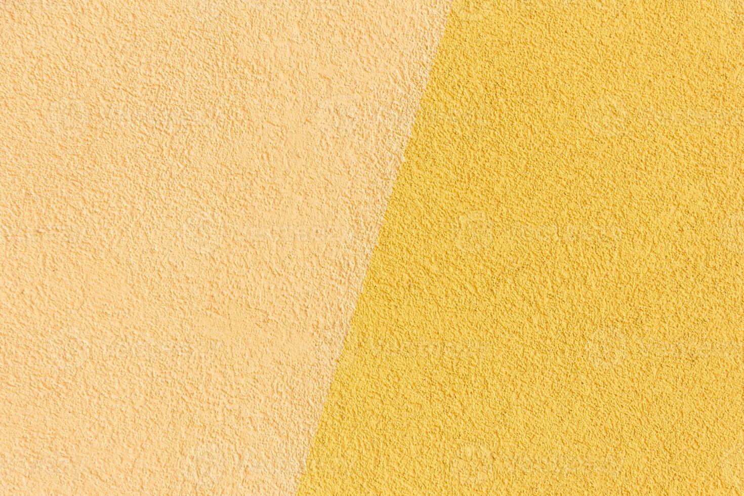 Yellow with beige wall texture. Warm color background. photo