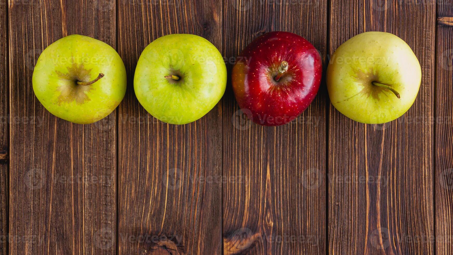 A few fresh apples on a wooden background photo