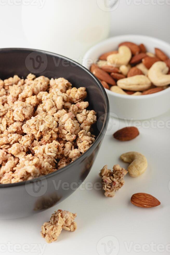 Granola in bowl on light background. photo