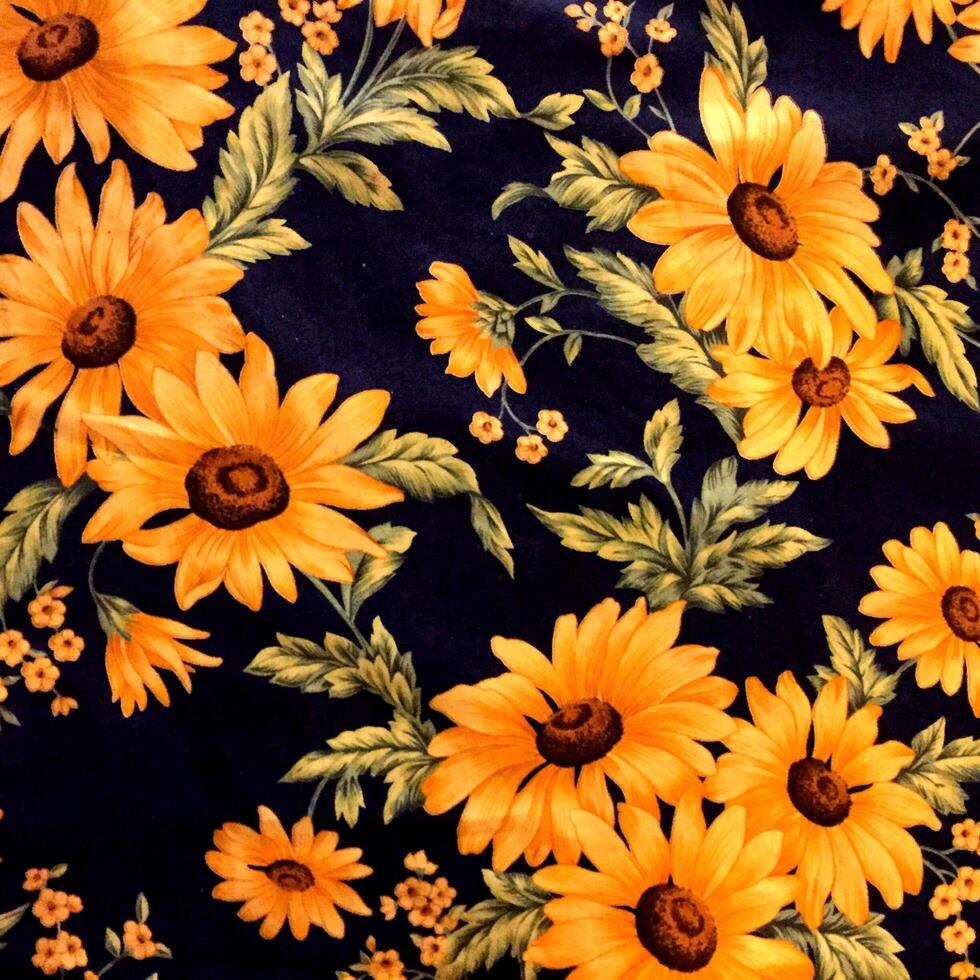 An intricately embroidered tablecloth adorned with a profusion of colorful blooms. photo