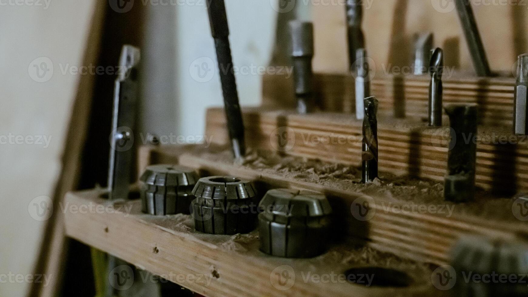 Various tools. file, screwdriver, hammer, pliers, garden tools are displayed on wooden shelf inside rustic garage or manufactory, workshop studio in a rustic garden house. Hobby, leasure activity. High quality photo
