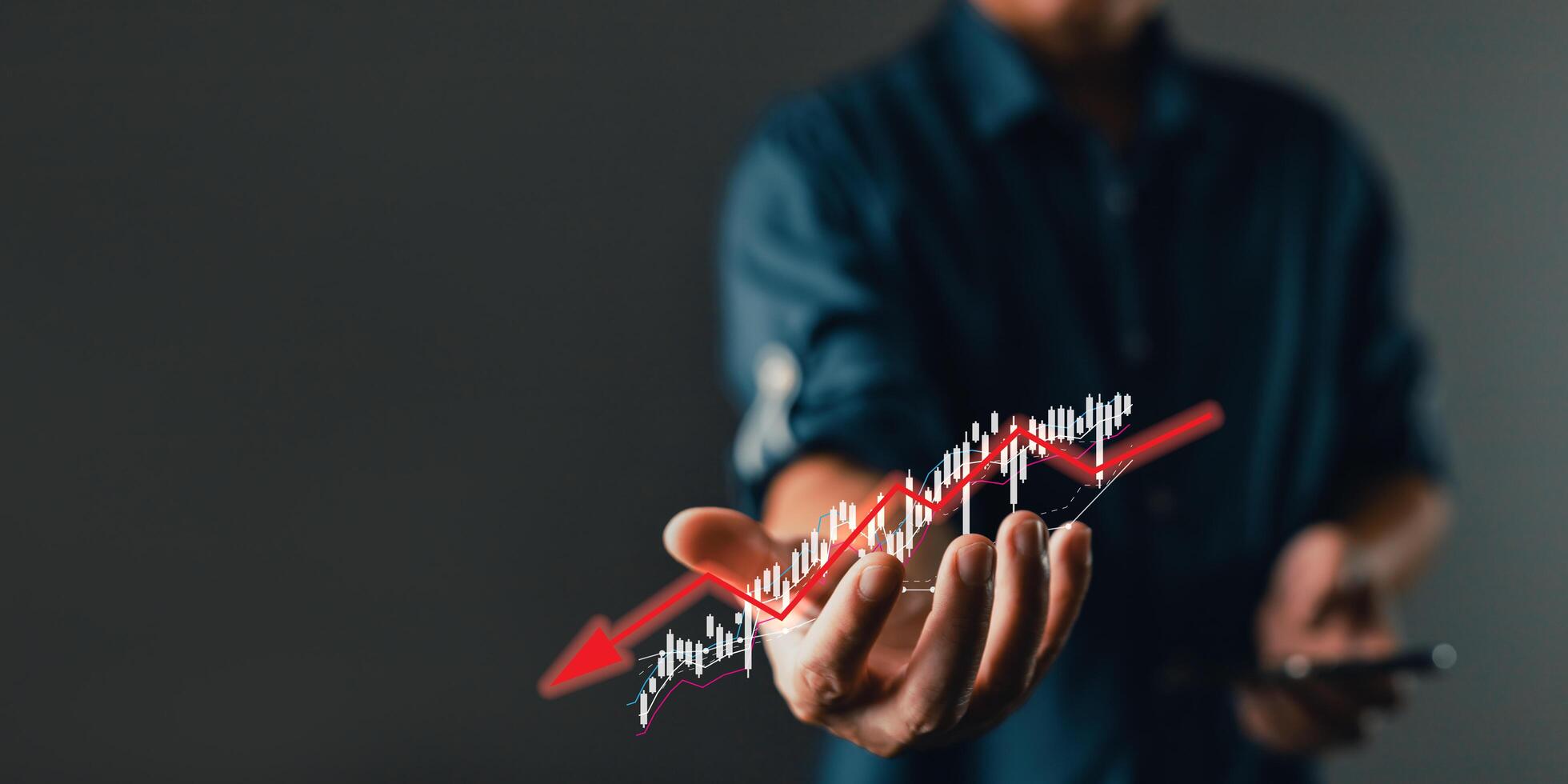 Businessman failure in the hands of businessmen. the graph downtrend, bear stock market, economic crisis, or recession. photo