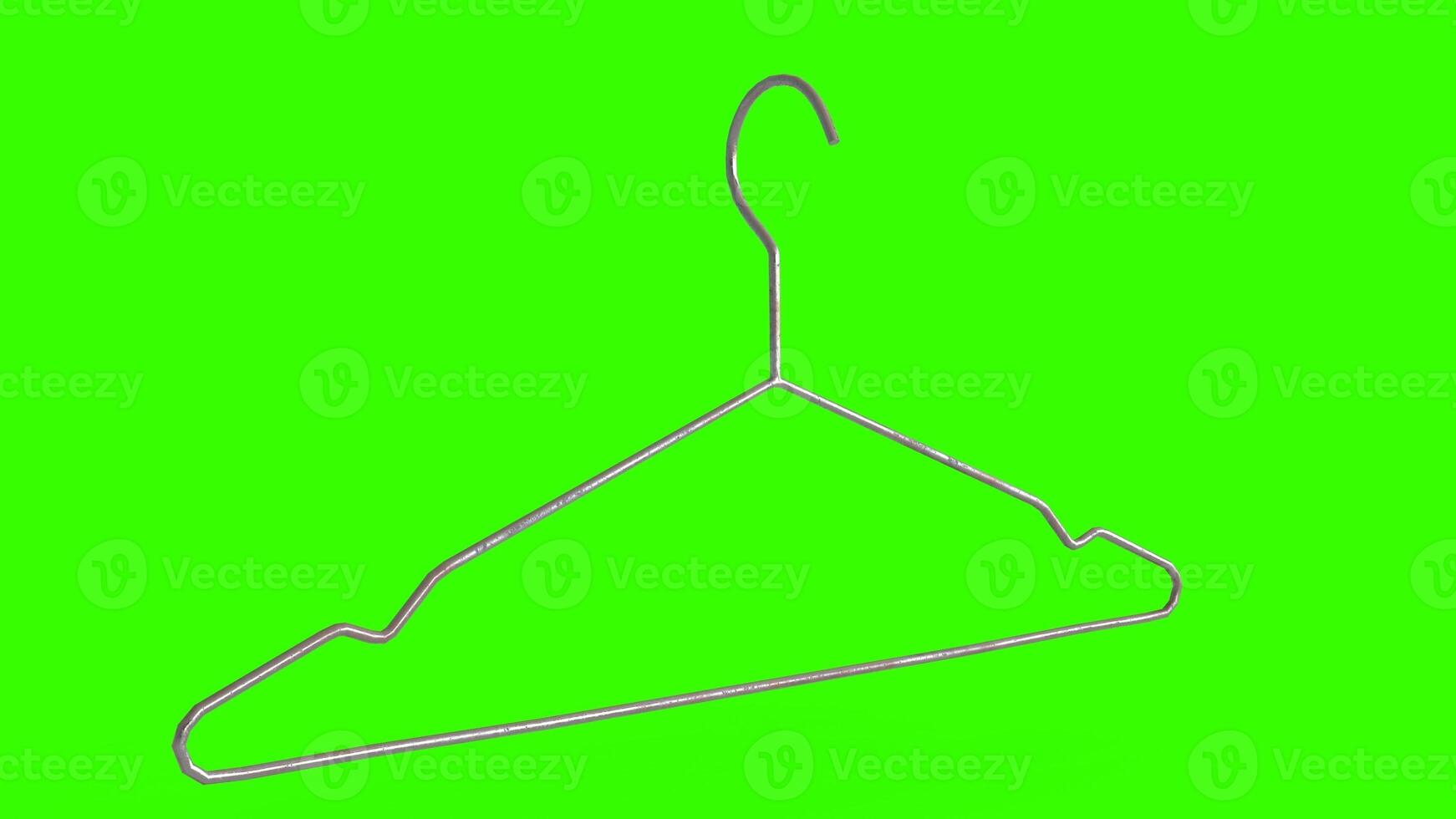 clothes hangers with green background photo
