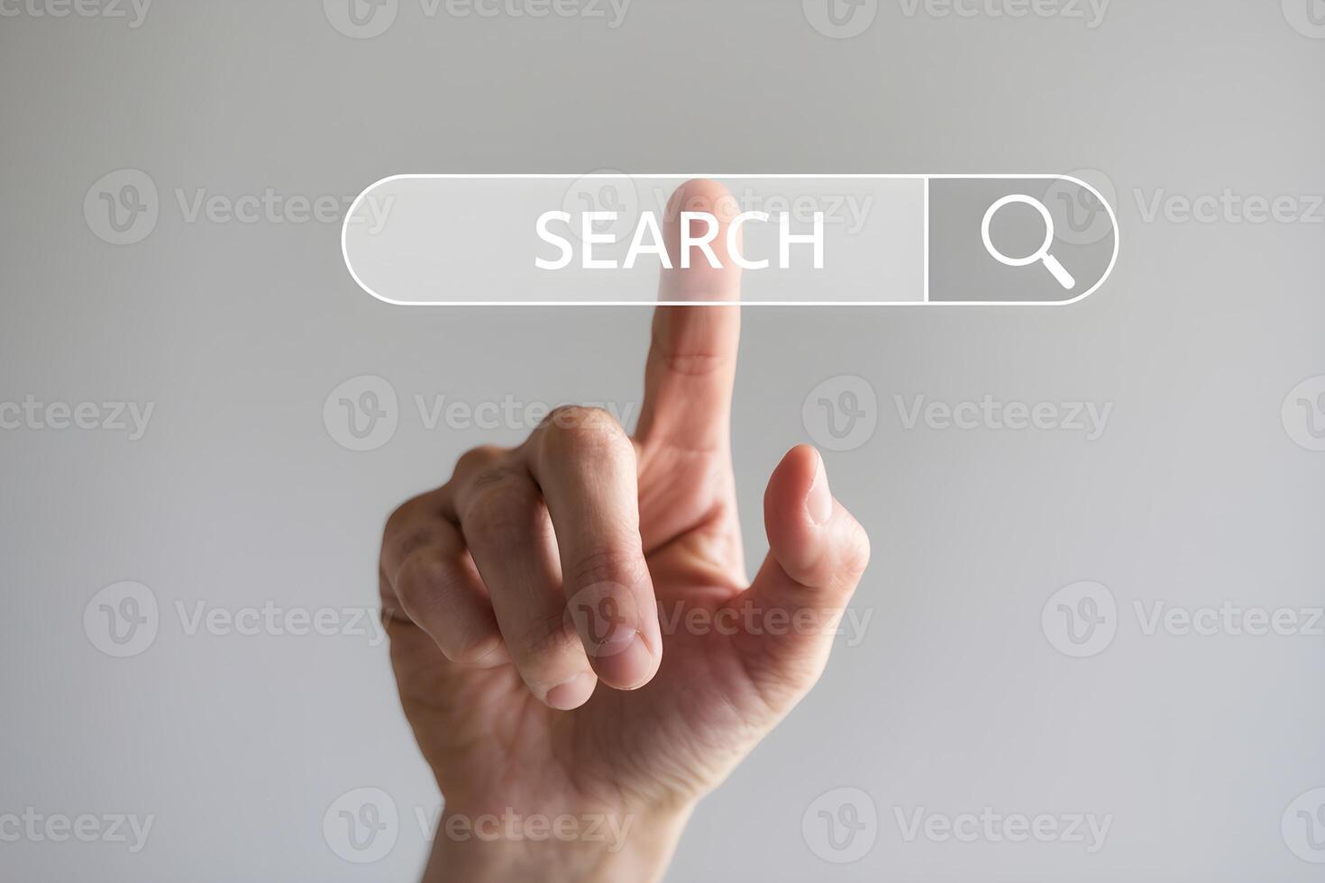 Hand poised over virtual search button, suggesting action in online exploration photo