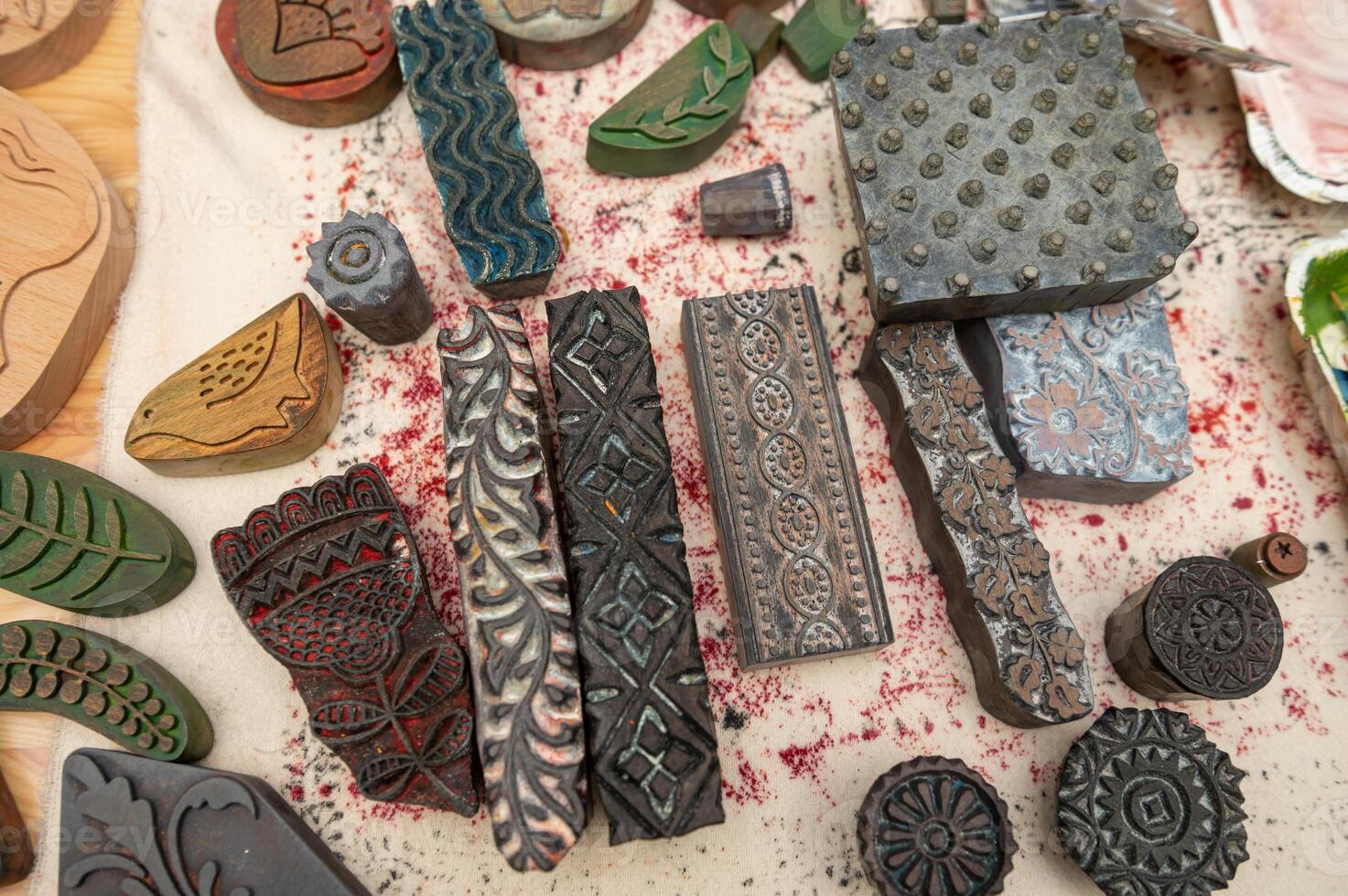 Intricate wooden stamps for fabric printing with various patterns and designs photo