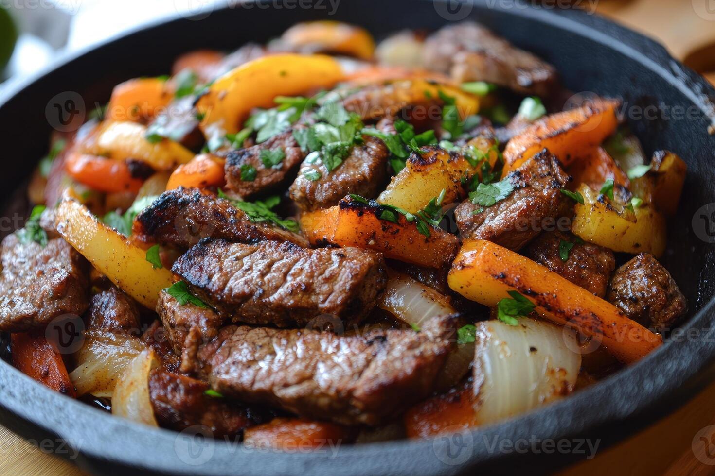 Sizzling fajitas with colorful peppers and beef in cast iron skillet photo