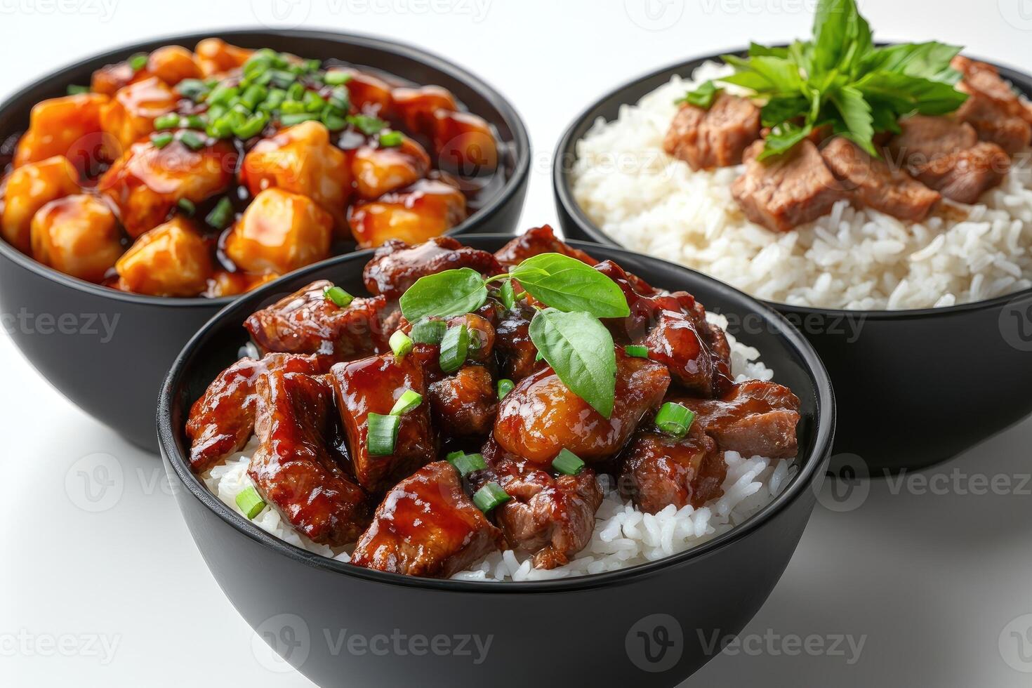 Tasty beef stew with white rice and herbs in black bowls photo