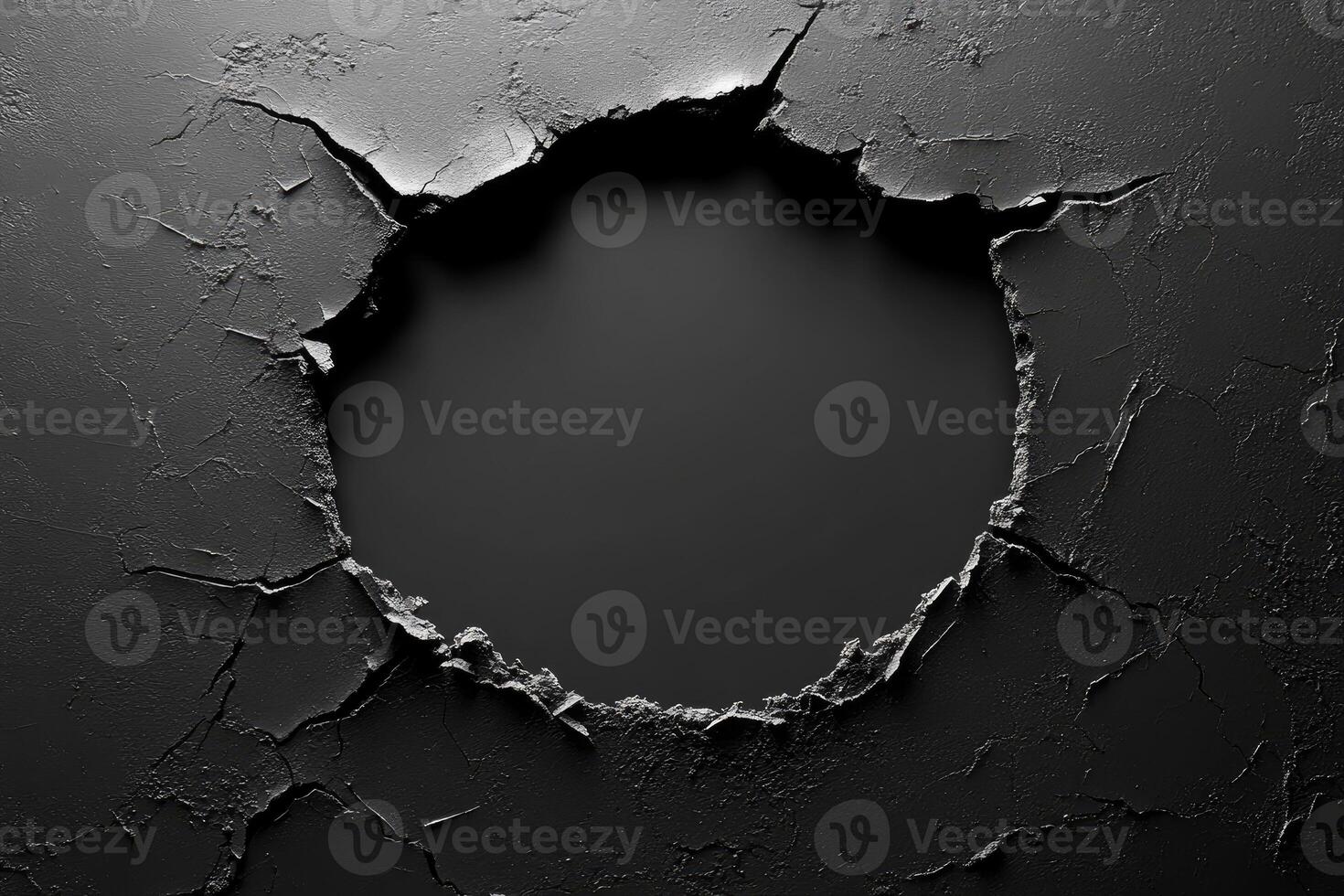 Broken black wall creating a circular hole revealing darkness photo