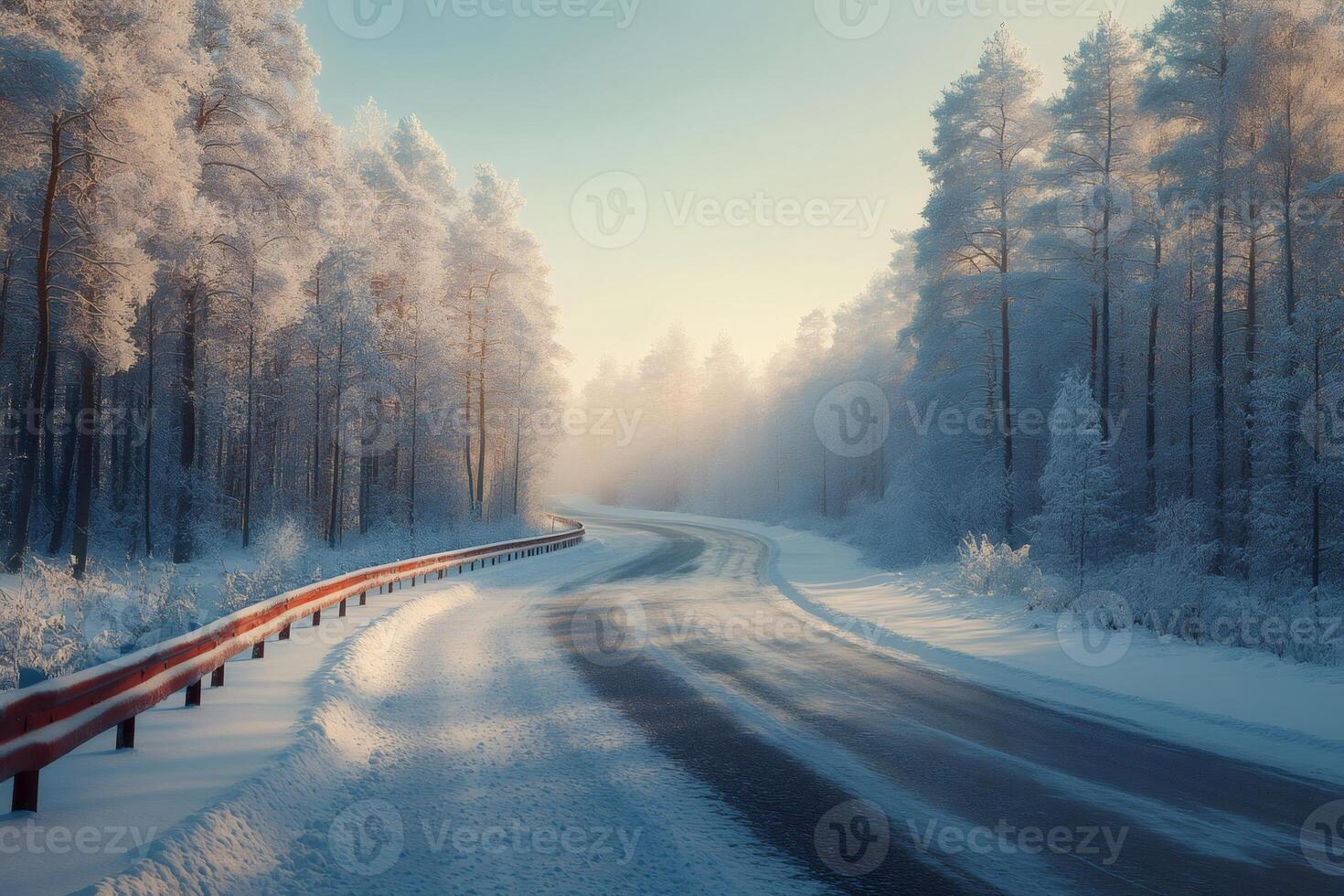 Snowy road winding through frosty winter forest at sunrise photo