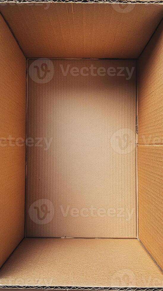 Empty cardboard box open from above, ready for packaging photo