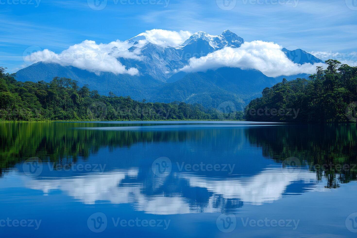 Majestic mountain reflecting on serene lake in lush rainforest photo