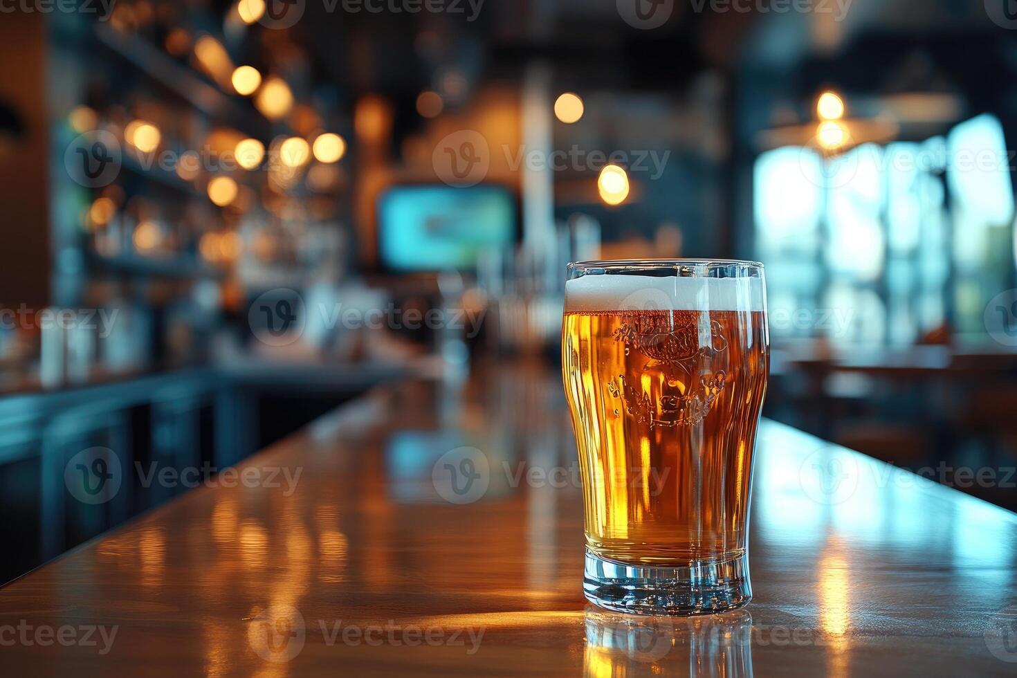 Pint of beer sitting on bar with blurred background showing bar and restaurant interior photo