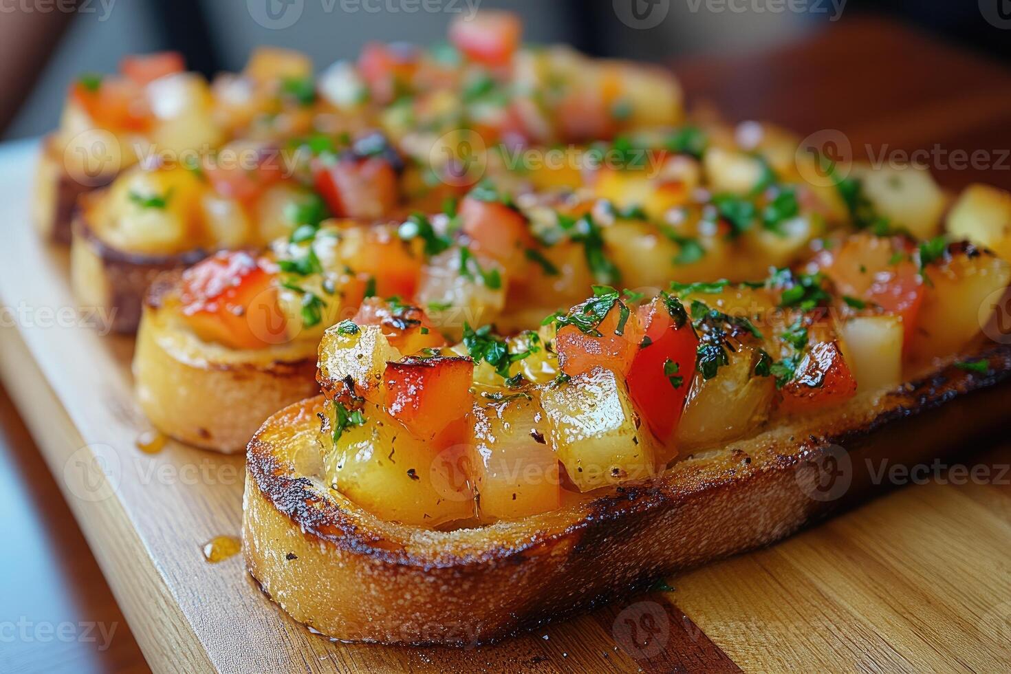 Delicious bruschetta with tomatoes, onions and potatoes resting on wooden board photo