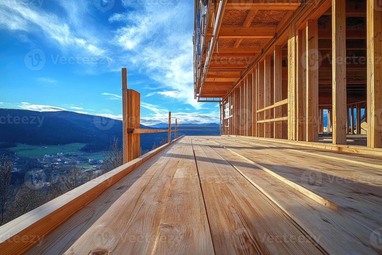 Wooden planks terrace of ecological sustainable house framing under construction with scenic valley view photo