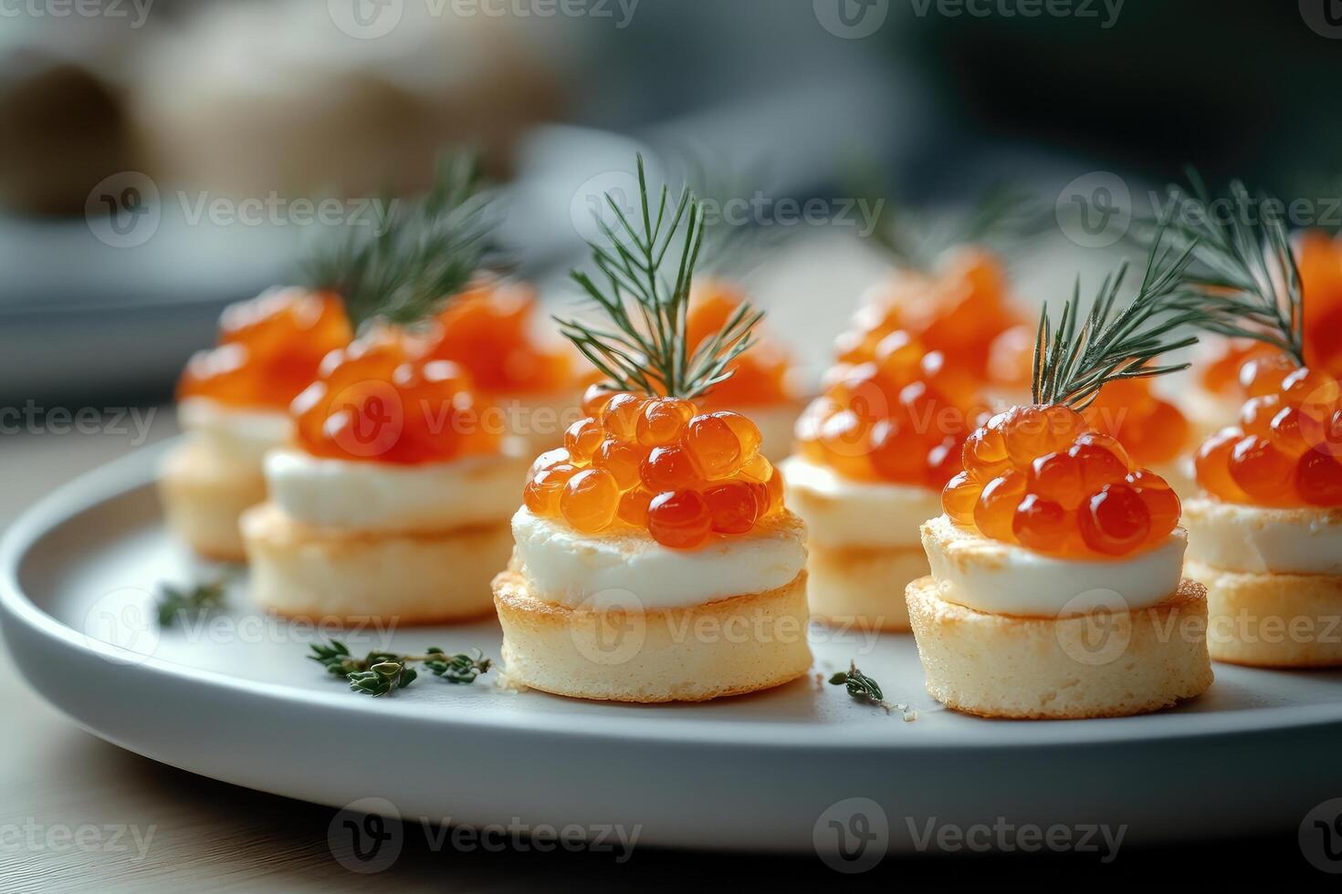 Delicious appetizers with red caviar and cream cheese decorating a catering event table photo