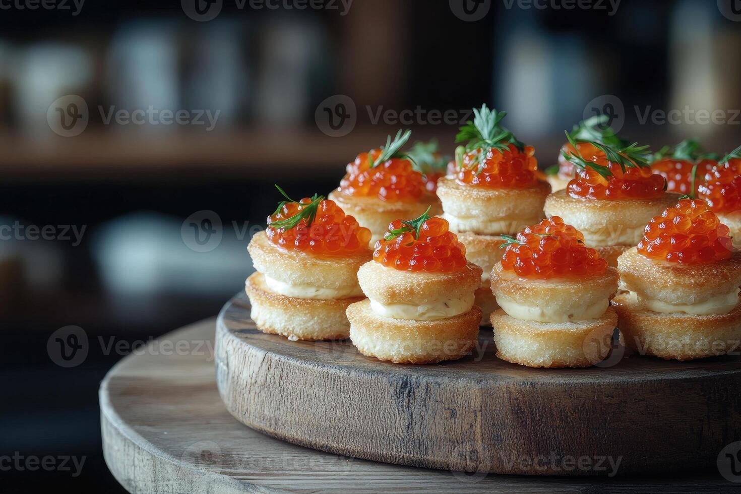 Delicious appetizers with red caviar and cream cheese decorating a catering event table photo