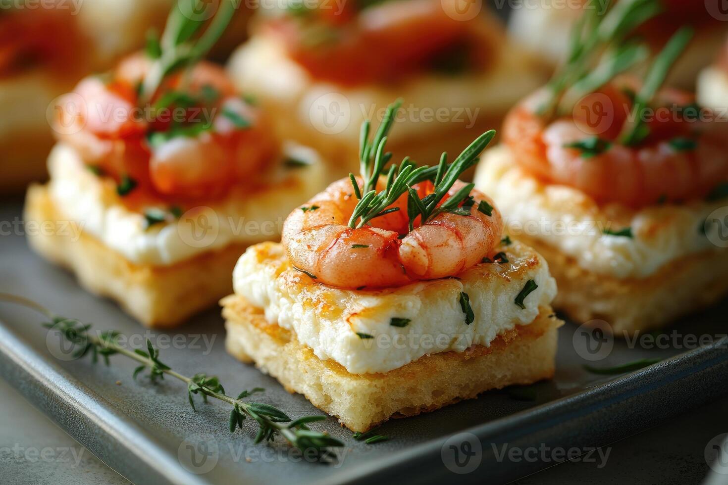 Delicious appetizers with grilled shrimps, ricotta cheese and rosemary topping golden toasts photo