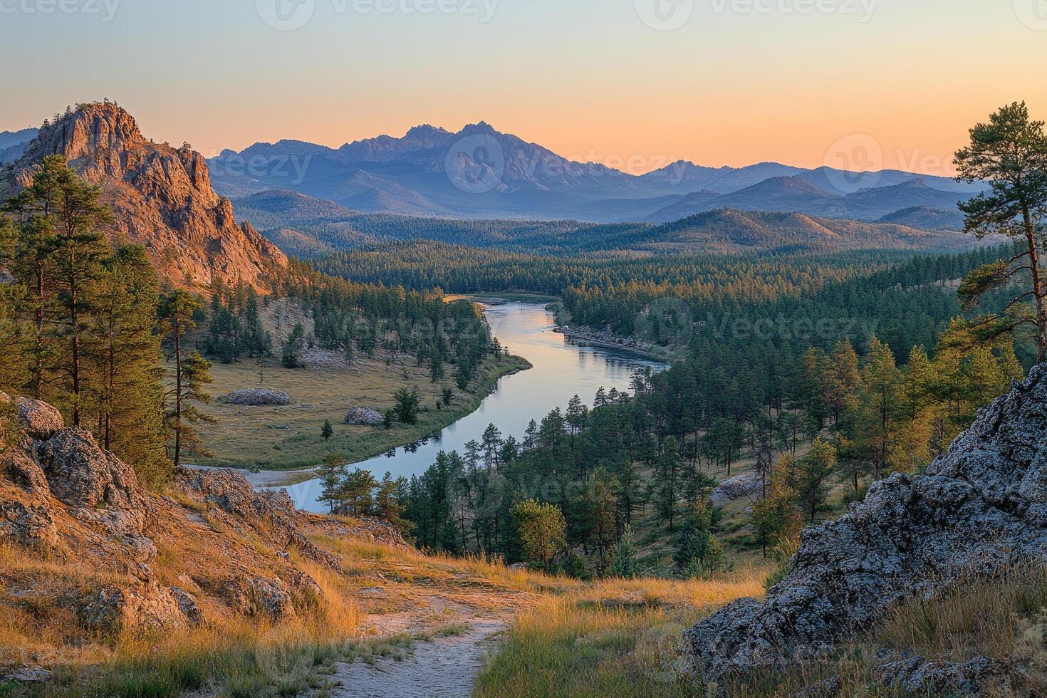 Breathtaking sunset illuminating river and mountains in the burabay national park photo