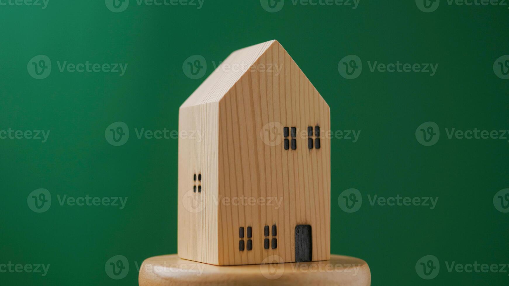 Wooden house model for home loans and cash, house projects, rental rooms and mortgage loans photo