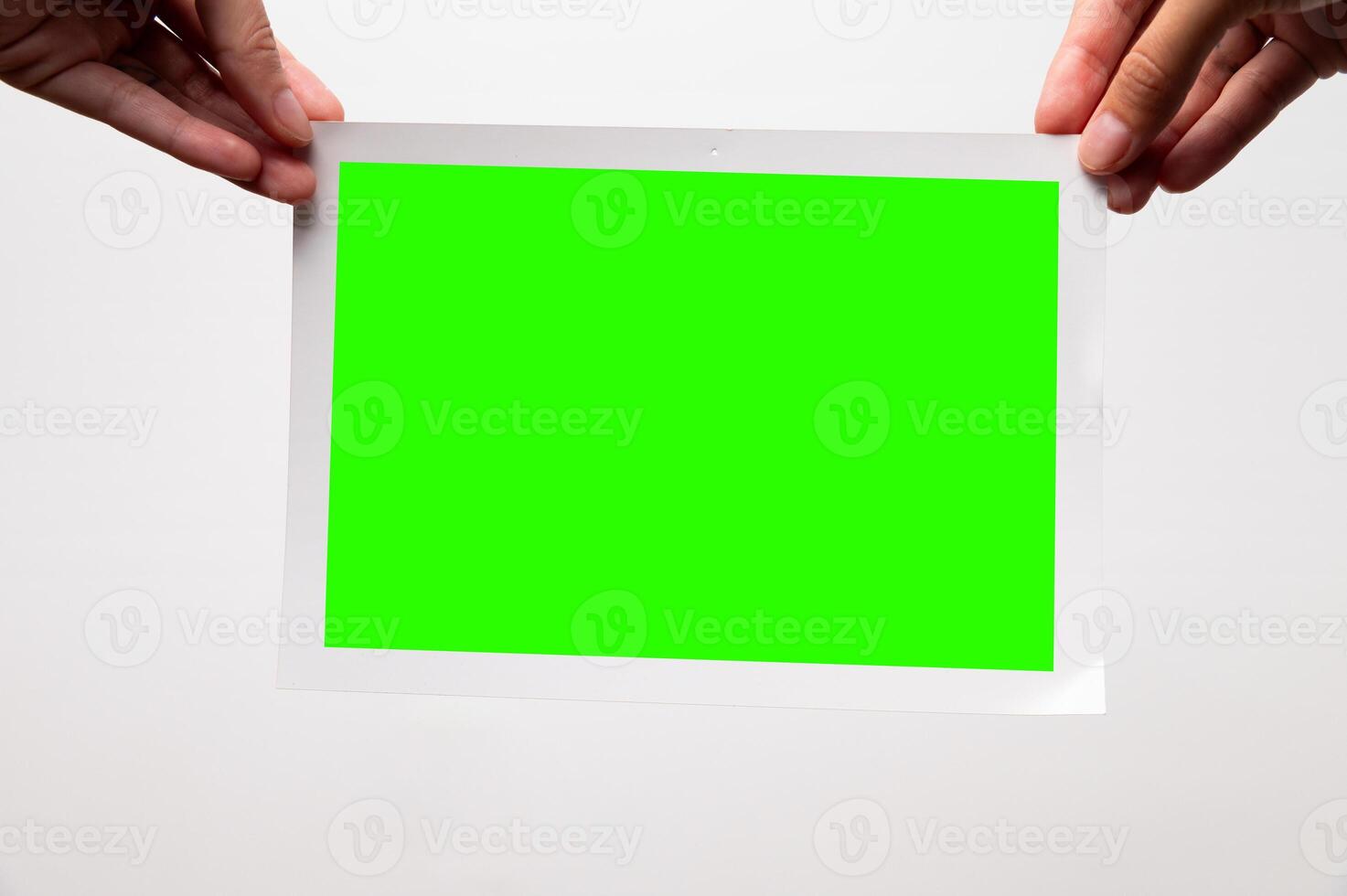 Photo frame mockup on white wall background. Large printed photo with borders on edges