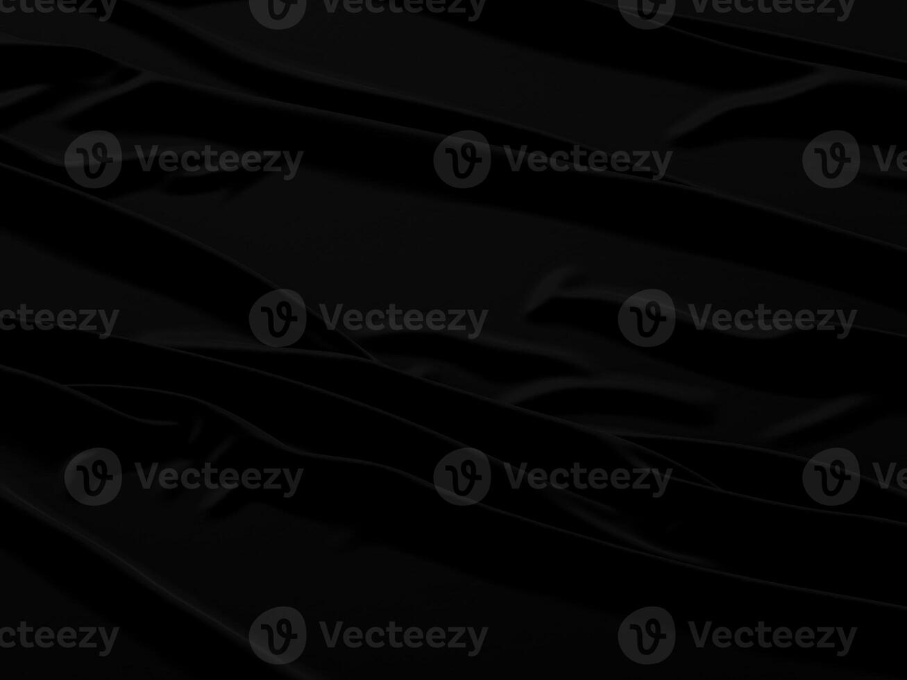 Black fabric background with waves and folds photo