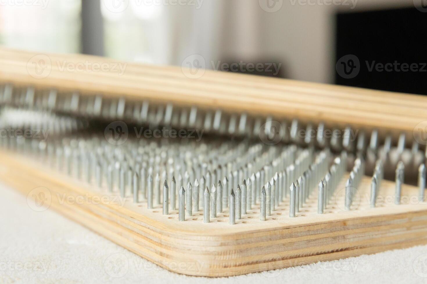 Close-up of Sadhu Board.yoga board with sharp nails. Yoga practice, meditation, concentration. . photo