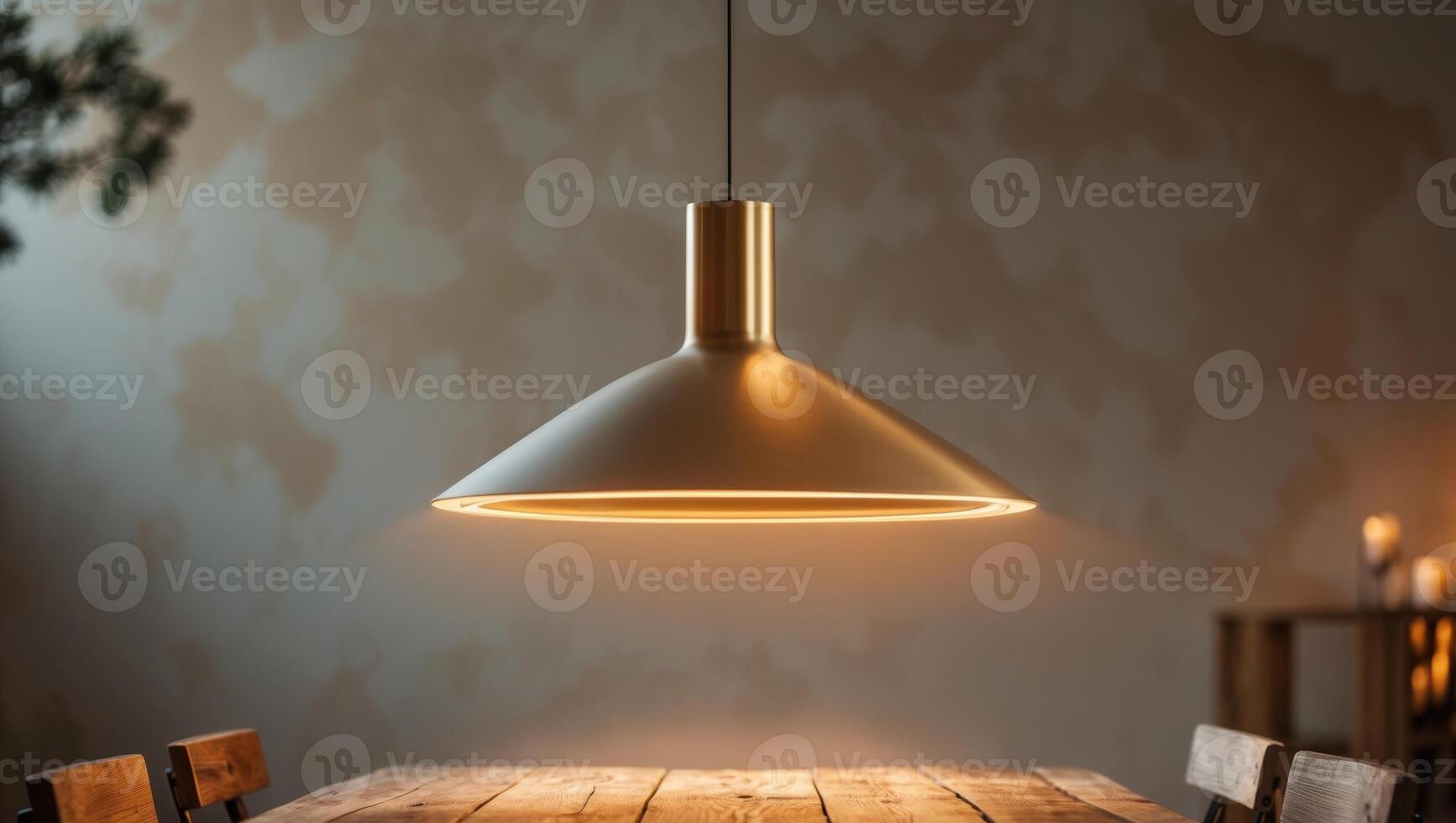 Warm kitchen lighting highlights a modern pendant lamp in a cozy setting during evening hours photo