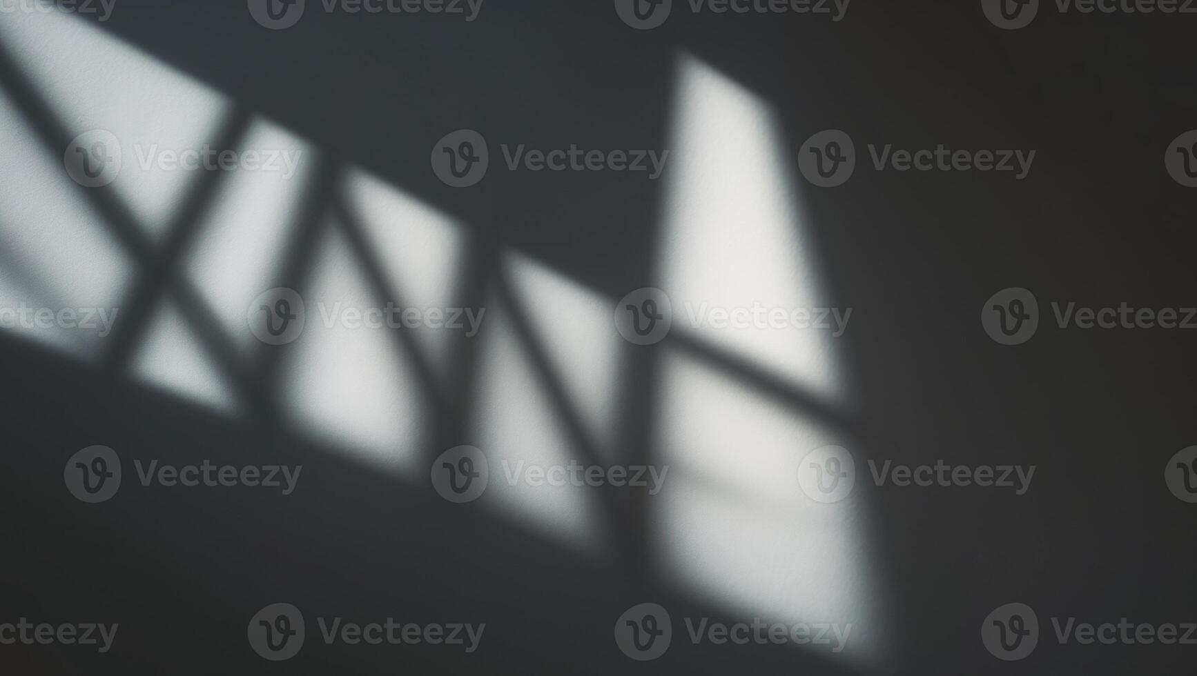 A shadow cast on a wall by a light photo