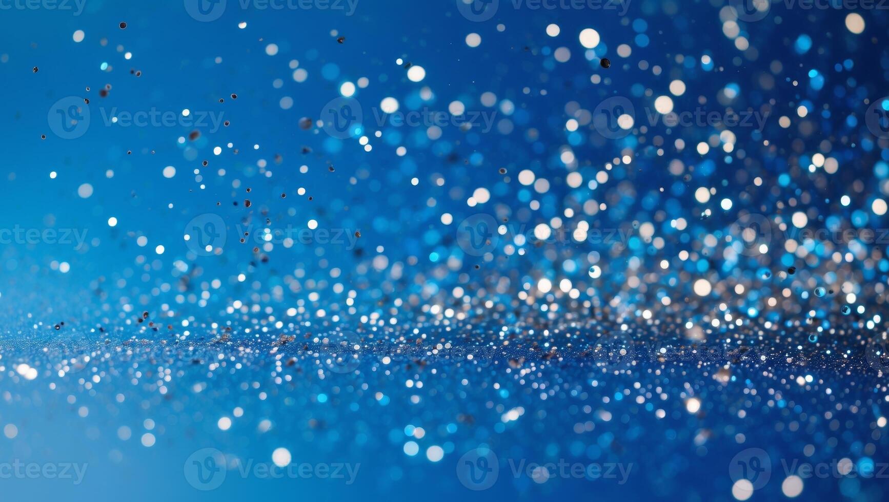 A blue background with a large amount of glitter scattered all over it photo