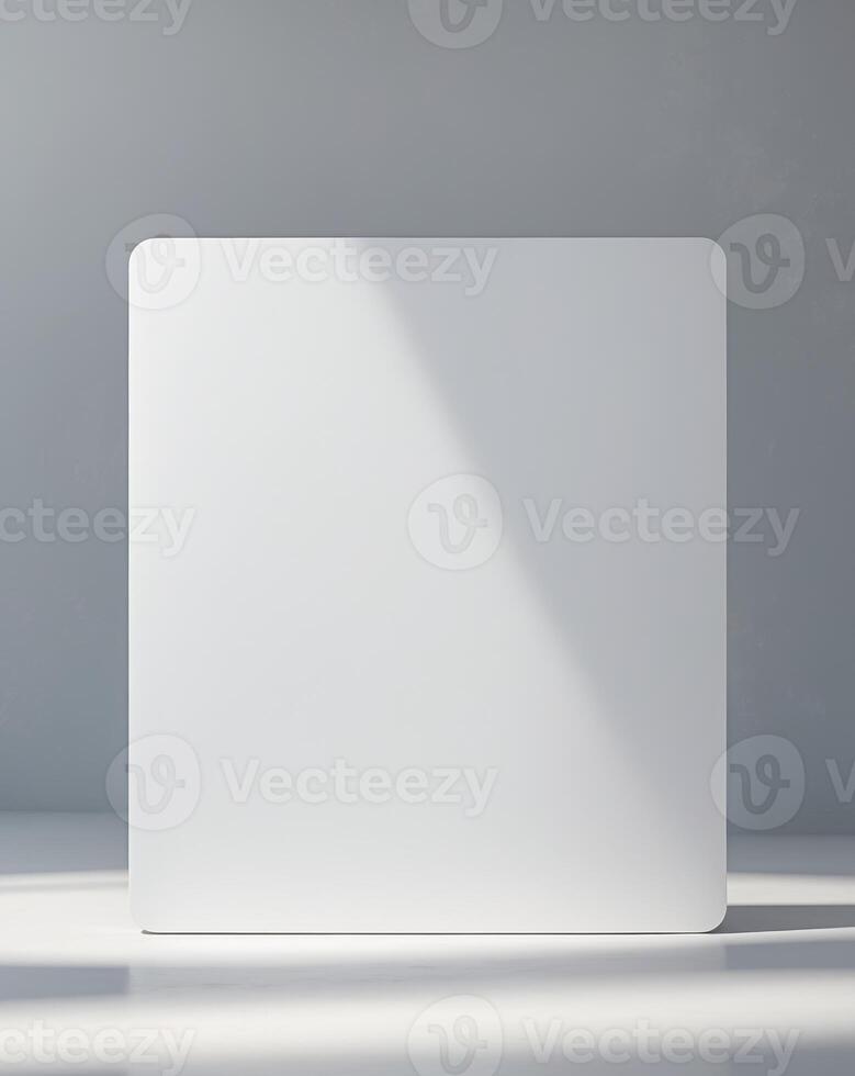 Blank white board on a gray background with copy space photo