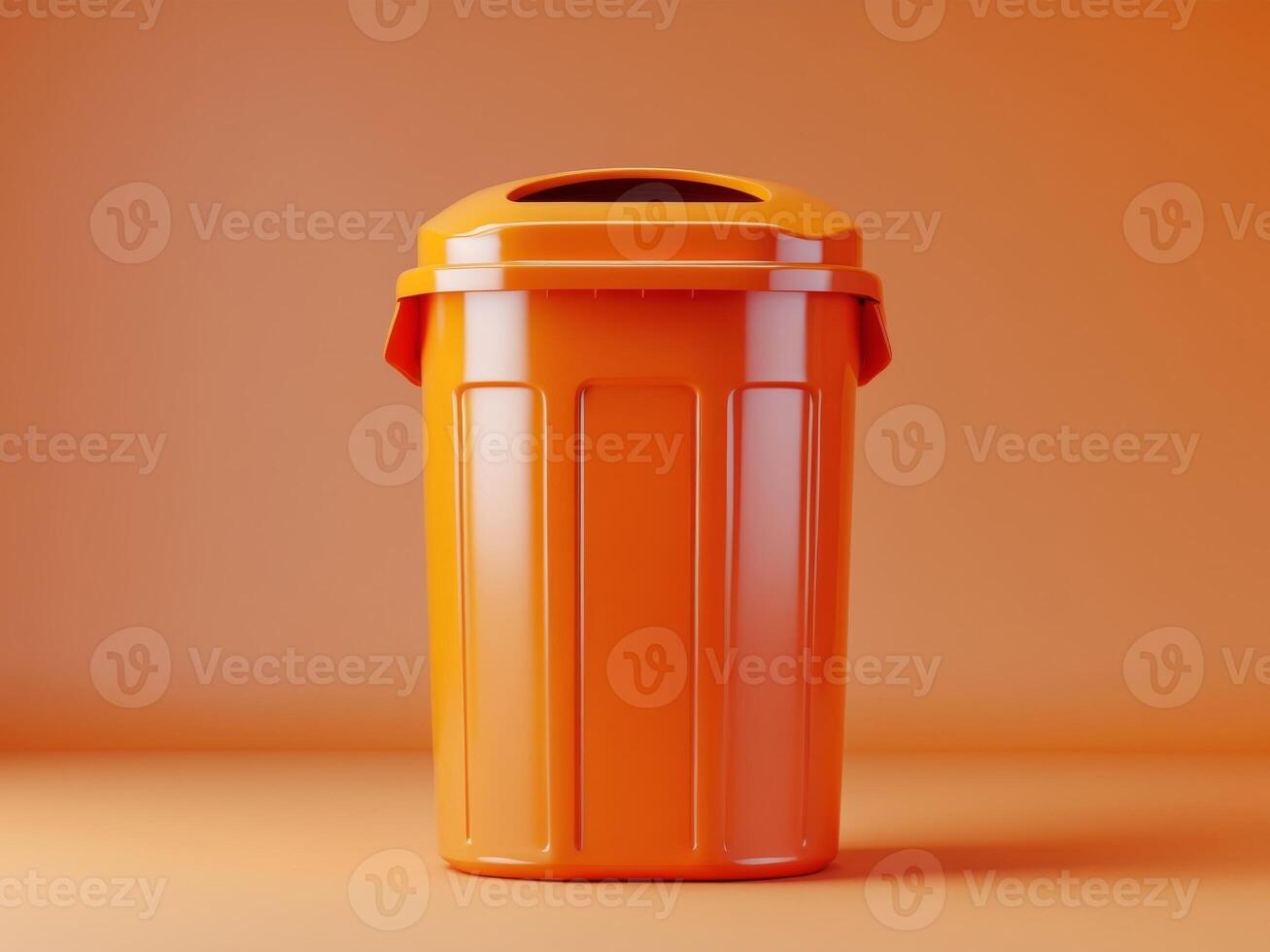 Orange garbage bin on orange background with copy space photo