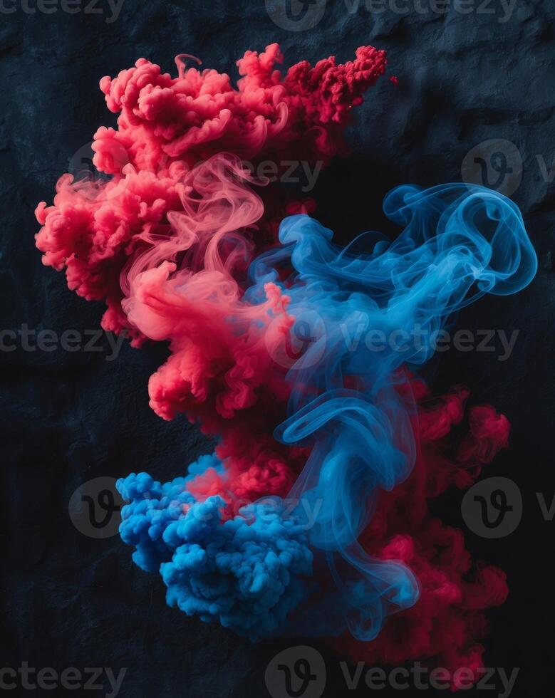 Vibrant swirls of red and blue smoke on black background photo